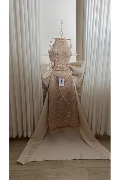 Onila Elegant beige evening dress with beadwork and a train