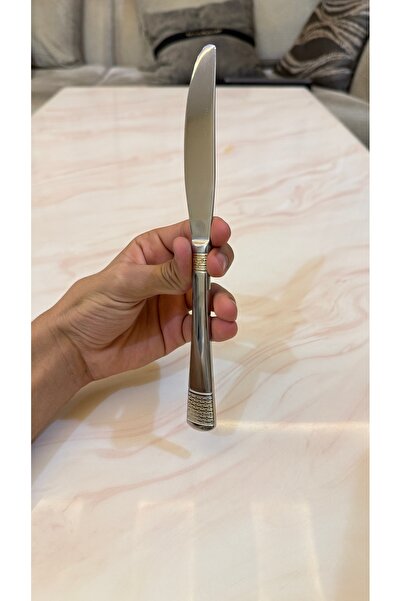 Palaces Silver and gold dinnerware sets including spoons, forks, and knives