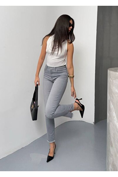 LACARINO Denim pants with cut-outs and tassel details