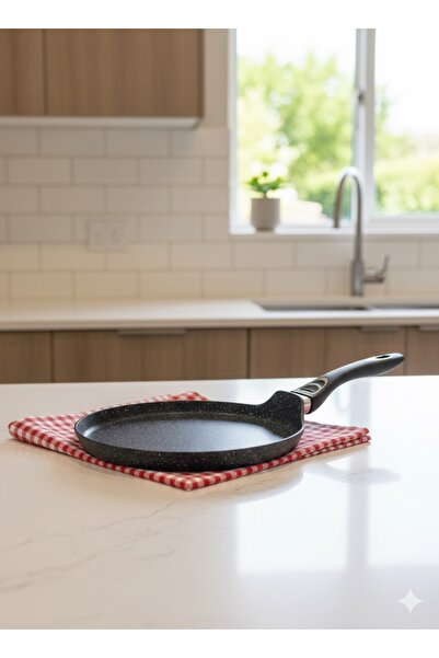 ABAREEK Non-stick frying pan with a dotted surface and black handle. 25 cm size