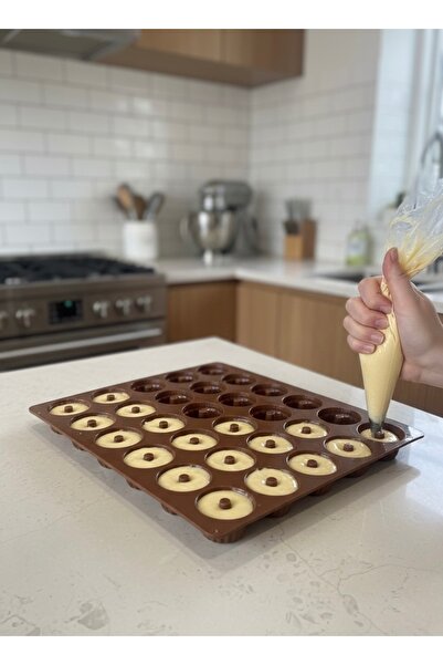 ABAREEK Silicone chocolate mold. Features multiple cavities in a circular spiral design. Holds 30 cups.