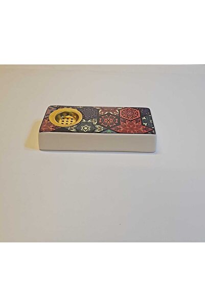 Rd A rectangular ceramic incense burner with an elegant design and patterns.