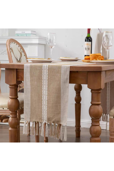 bity thok A luxurious dining tablecloth with a unique embroidered design in beige and elegant scalloped edges.