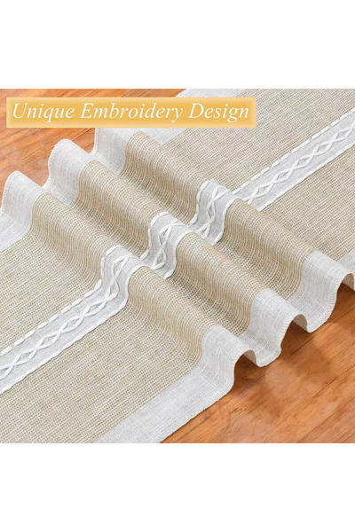 bity thok A luxurious dining tablecloth with a unique embroidered design in beige and elegant scalloped edges.