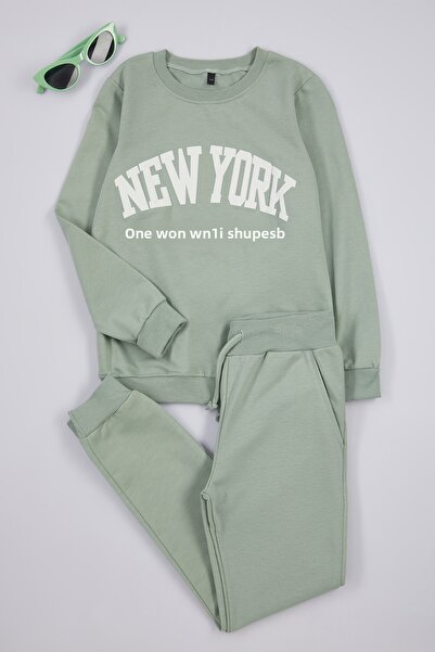 TRENDYOLKIDS Mint pamut szlogennel nyomtatott lányok kötött pulóver és melegítőnadrág alsó felső szett TKDAW25AU00038