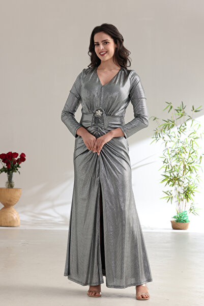 FUN BY AL BAYADER فن A shimmering silver evening dress with a gathered silhouette and an elegant front slit.