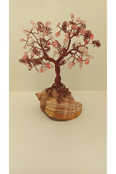Cristaltree Decorative tree made of rose quartz crystals and cherry quartz on a sea snail