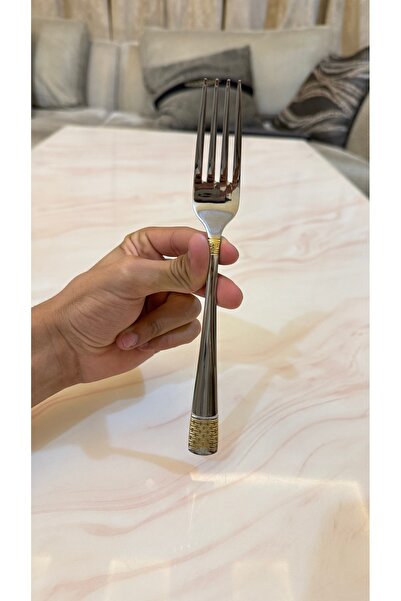 Palaces Silver and gold dinnerware sets including spoons, forks, and knives