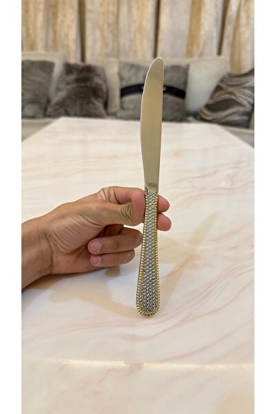 Palaces Silver and gold dinnerware sets including spoons, forks, and knives