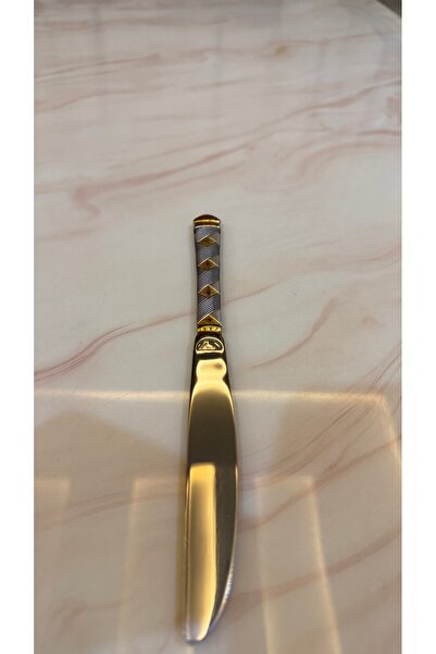 Palaces Silver and gold dinnerware sets including spoons, forks, and knives