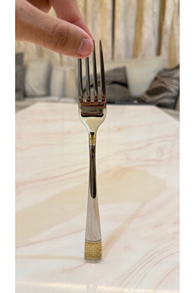 Palaces Silver and gold dinnerware sets including spoons, forks, and knives