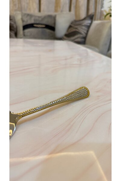 Palaces Silver and gold dinnerware sets including spoons, forks, and knives