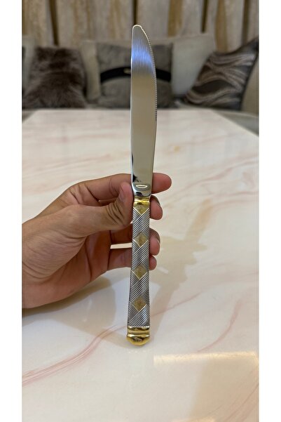 Palaces Silver and gold dinnerware sets including spoons, forks, and knives