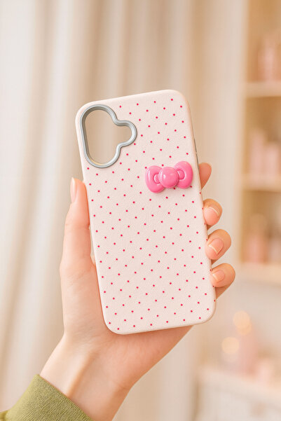 MustCase حافظة هاتف آيفون 17 باللون الوردي مع تفاصيل فيونكة منقطة، تصميم أنيق...