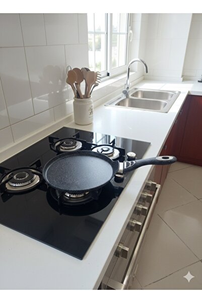 ABAREEK Non-stick frying pan with a dotted surface and black handle. 25 cm size