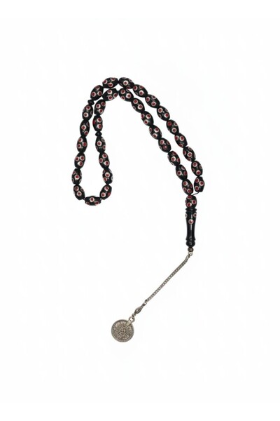 RAM A burnt yusr rosary, inlaid with mother-of-pearl and featuring unique embroidery.