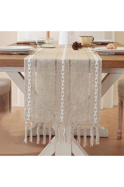 bity thok A luxurious beige tablecloth with a modern design and interlocking strand edges.