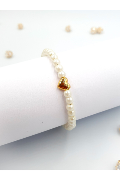 Stella Fortis 💛   سوار نسائي من اللؤلؤ مع تفاصيل قلب ذهبي