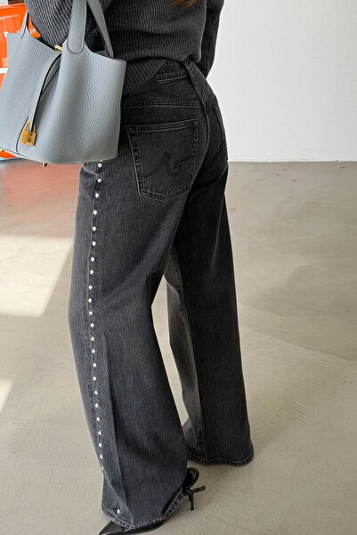 Özge Özgenç Джинси з асиметричним кроєм і заклепками