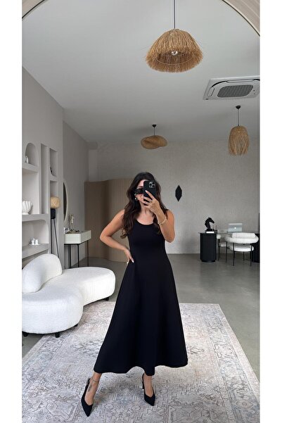 Buket Teke طقم مكون من بلوزة وفستان أسود من المودال