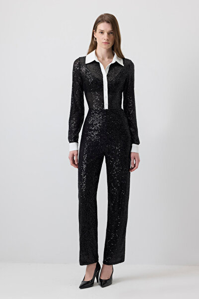 Touché Privé Jumpsuit with Front Patch, Sequin Detail, and Tulle.