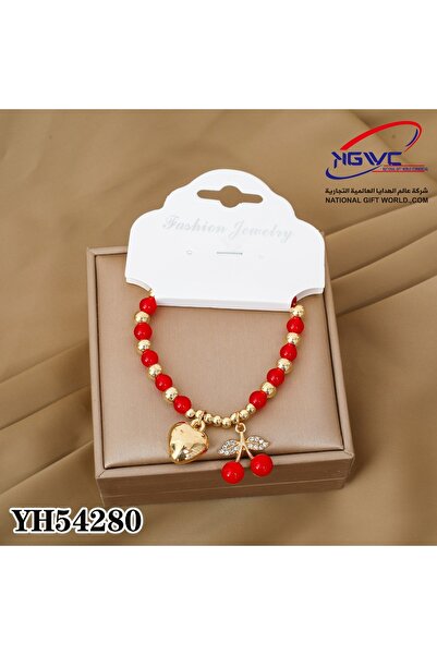 KAZUKO Red and gold beaded bracelet with a heart and cherry pendant.