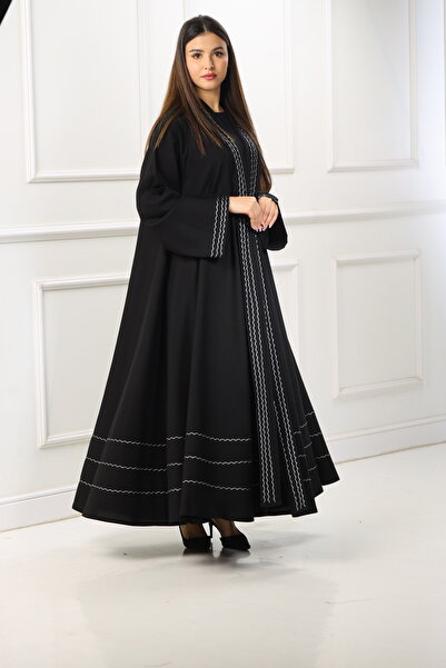 ZAHRA Black open-front abaya with a double-layered flared design, adorned with white woven lines made from internet fabric - a serene design with meticulous details.