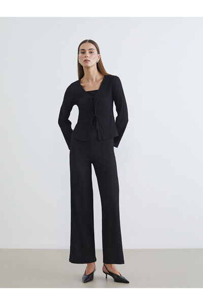 LC Waikiki Μαύρο γυναικείο παντελόνι με ελαστική μέση με υφή φαρδύ πόδι