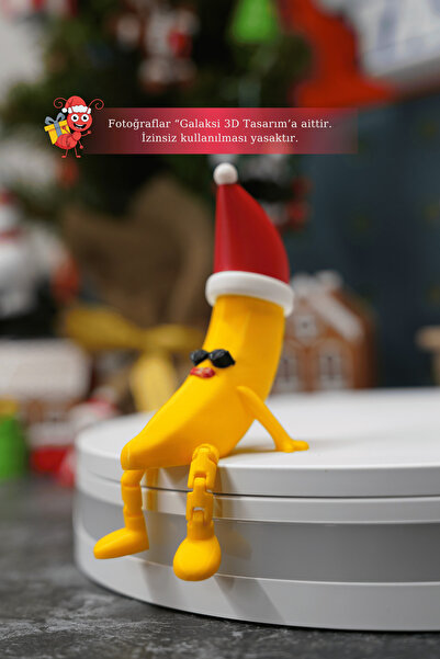Galaksi 3D Noel Şapkalı Muz Adam Figürü – Komik Dekor