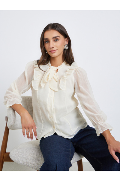 Styli بلوزة بيج بكشكشة ورباط حول الرقبة