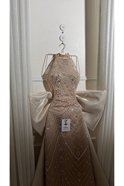 Onila Elegant beige evening dress with beadwork and a train