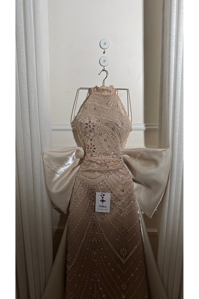 Onila Elegant beige evening dress with beadwork and a train