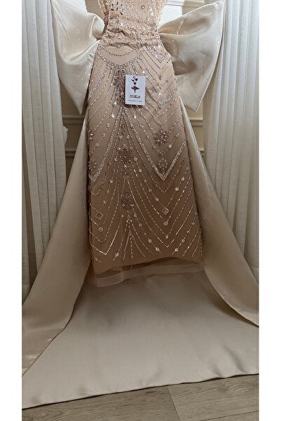 Onila Elegant beige evening dress with beadwork and a train