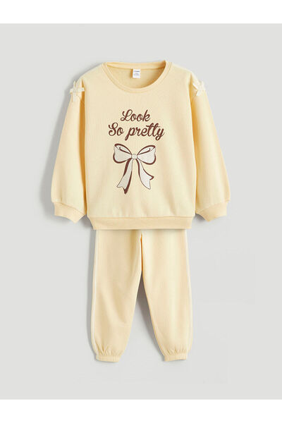 LC Waikiki مجموعة إلسيفا سترة وبنطلون مطبوعان باللون الأصفر للفتيات، طقم من ق...