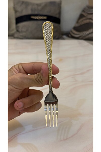 Palaces Silver and gold dinnerware sets including spoons, forks, and knives