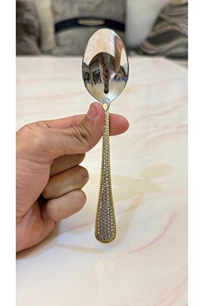 Palaces Silver and gold dinnerware sets including spoons, forks, and knives