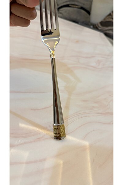 Palaces Silver and gold dinnerware sets including spoons, forks, and knives