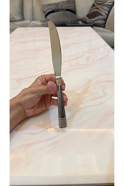 Palaces Silver and gold dinnerware sets including spoons, forks, and knives