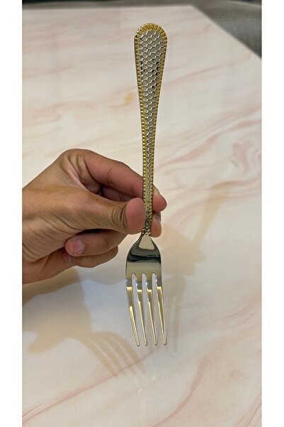 Palaces Silver and gold dinnerware sets including spoons, forks, and knives