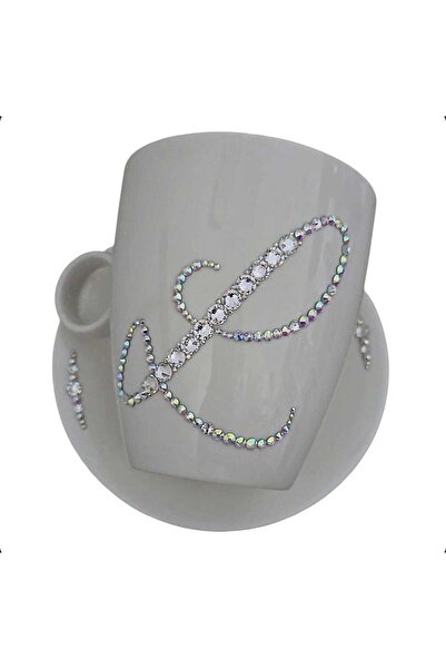 by Alexandra Vacarusi Cup and saucer set decorated with Crystals, initial L, 540ml cup,