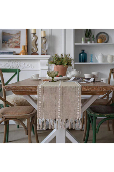 bity thok A luxurious beige tablecloth with a modern design and interlocking strand edges.