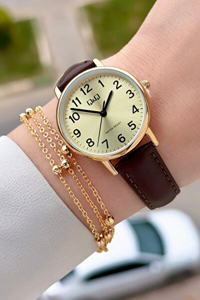 Q&Q Kasası Gold Kordonu Kahverengi Renk 30,5 Mm Rakamlı Kadın Kol Saati ve He...