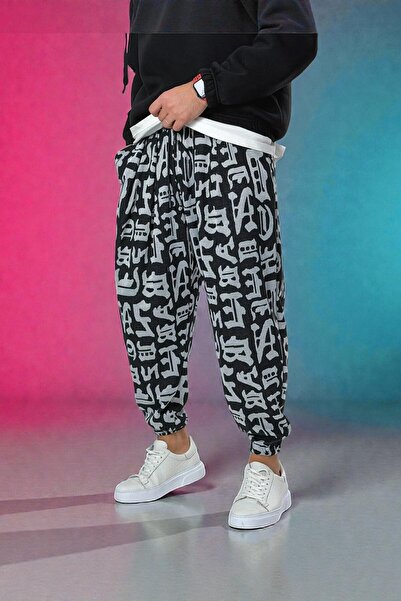 COCOPELLI Ανδρικό πλισέ μισό φαρδύ παντελόνι με μοτίβο γράφιτι και ελαστικές τσέπες στα πόδια, χαλαρό hippie bohemian φαρδύ παντελόνι