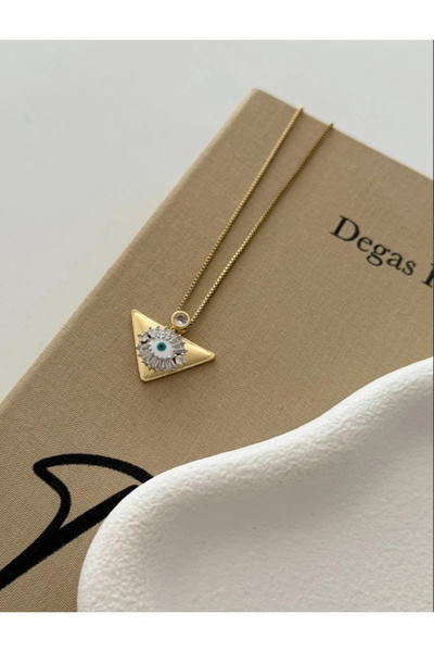 naaksesuar قلادة على شكل عين من الفولاذ الملون بالذهب مع تفاصيل مثلثة