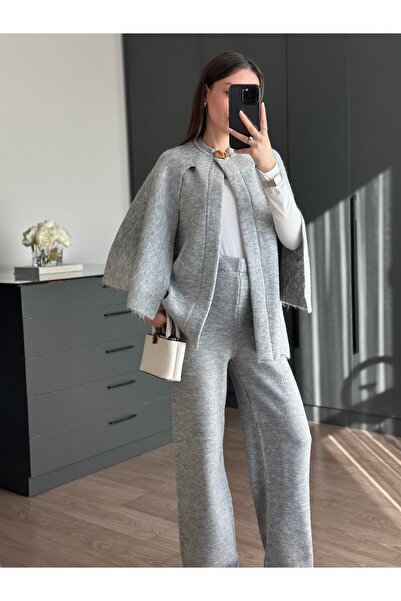 Tugen Co معطف تريكو رمادي اللون مع تفاصيل أزرار معدنية