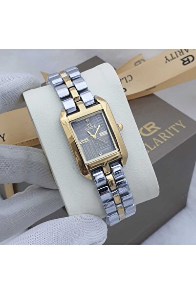 Generic Clearity watch with box, bag, and card; water-resistant; stainless steel case; beige band; silver and gold strap.