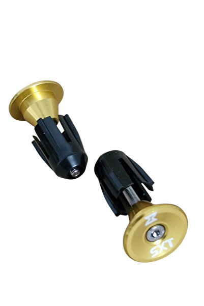 SXT Set of bicycle handlebar ends in gold color.