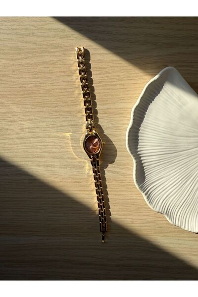 rubsey ساعة يد نسائية كلاسيكية بتصميم معدني بسيط مع حزام داخلي وردي اللون