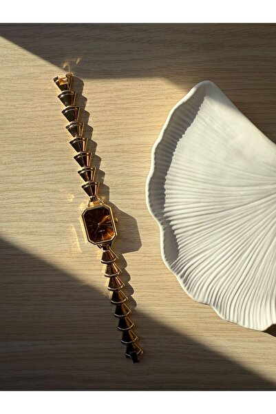 rubsey ساعة يد نسائية كلاسيكية بتصميم معدني بسيط مع حزام داخلي بني اللون