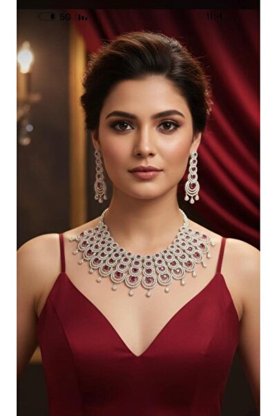 SS A silver zircon set with navy blue stones. The set consists of a necklace, earrings, and a ring.